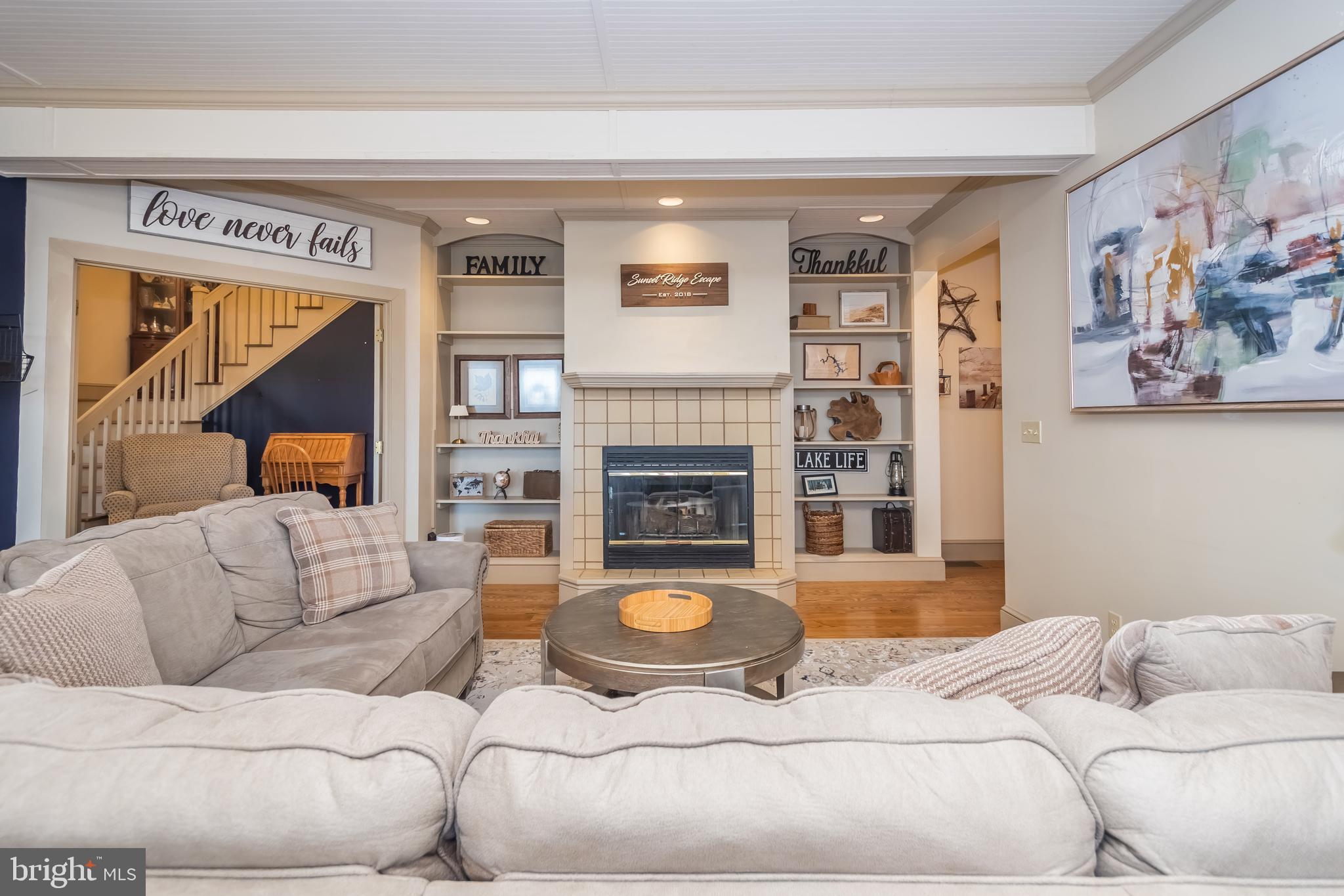 726 Sunset Ridge Drive McHenry, MD 21541 - Photo 16 of 50 a living room with furniture and a fireplace