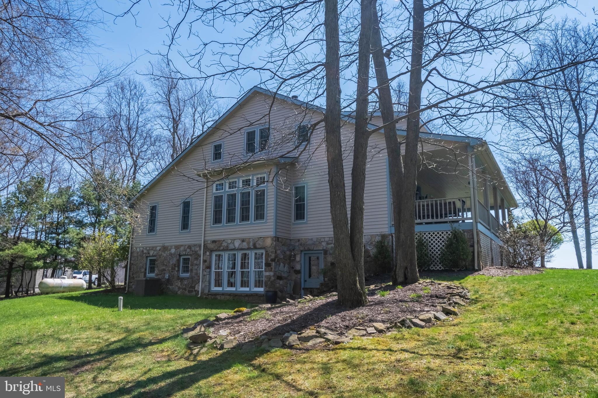 726 Sunset Ridge Drive McHenry, MD 21541 - Photo 4 of 50 a front view of a house with a yard