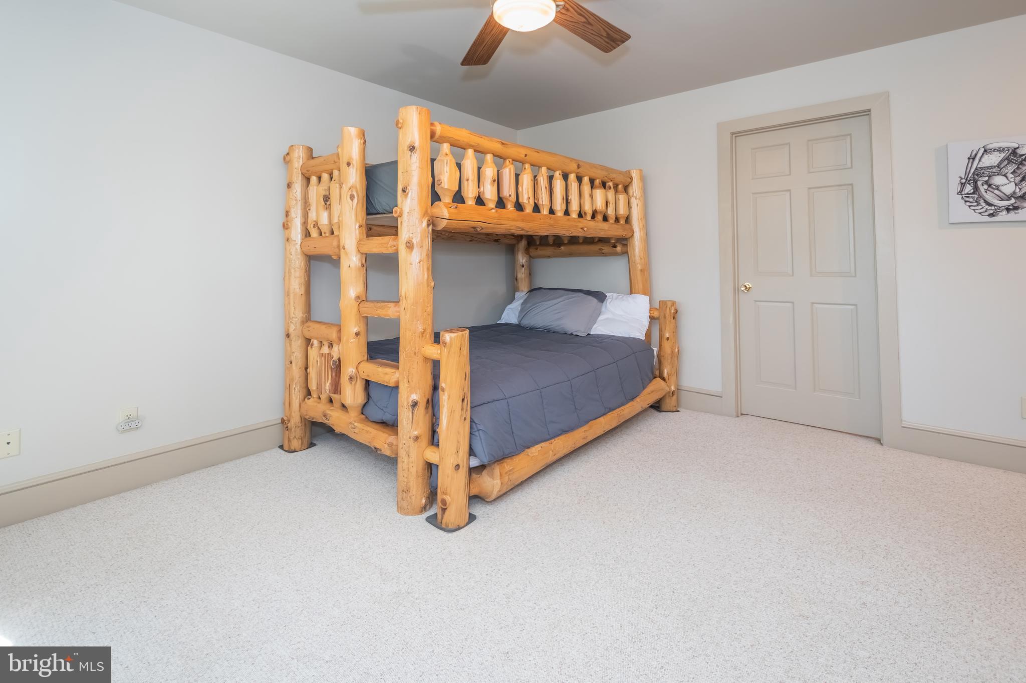 726 Sunset Ridge Drive McHenry, MD 21541 - Photo 43 of 50 a bedroom with a bed and a chandelier