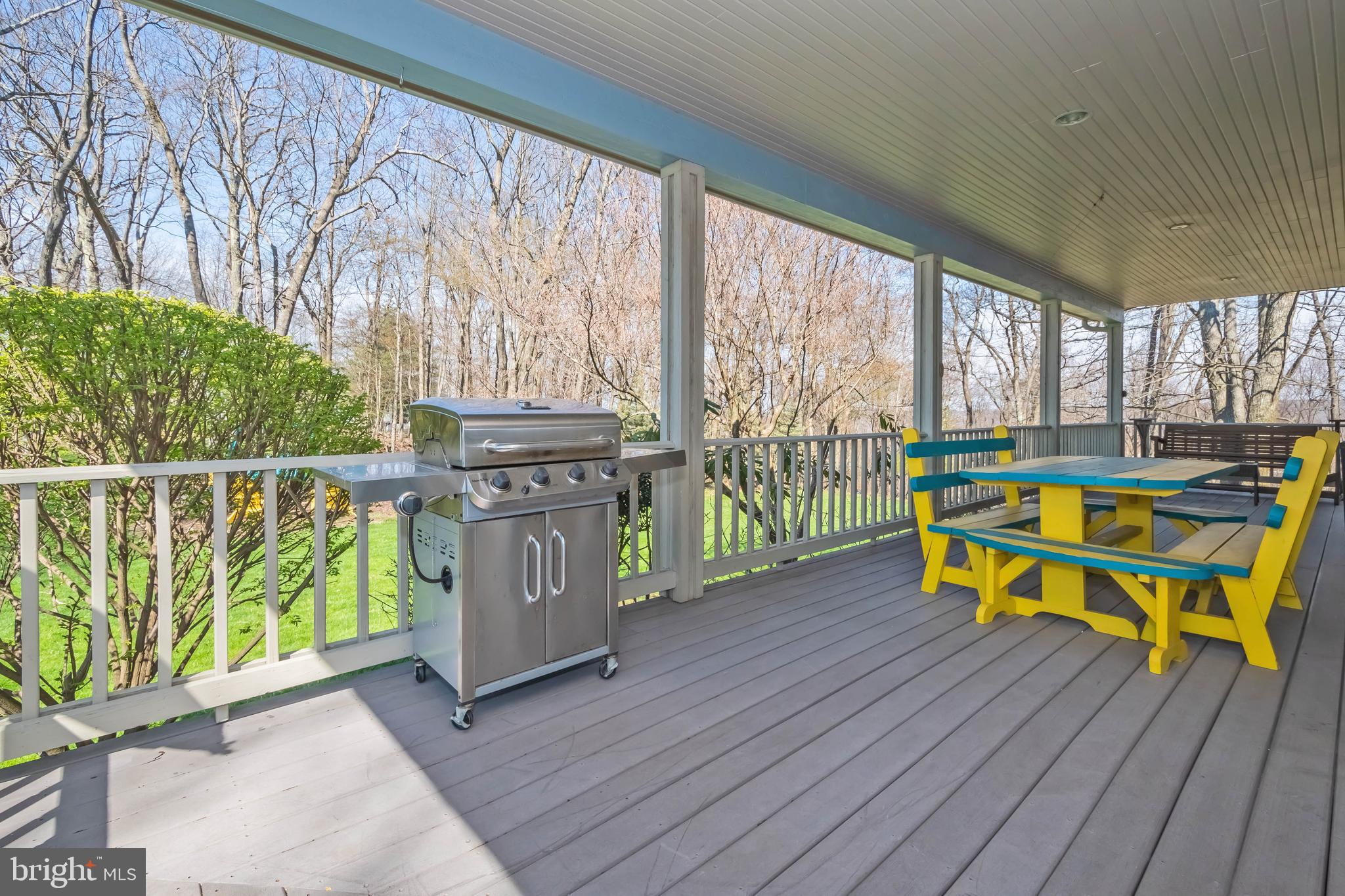 726 Sunset Ridge Drive McHenry, MD 21541 - Photo 45 of 50 a view of a chairs and table in patio with wooden fence