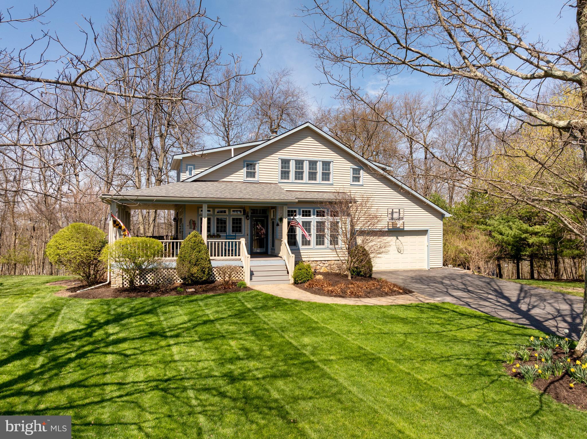 726 Sunset Ridge Drive McHenry, MD 21541 - Photo 50 of 50 a front view of a house with garden and porch