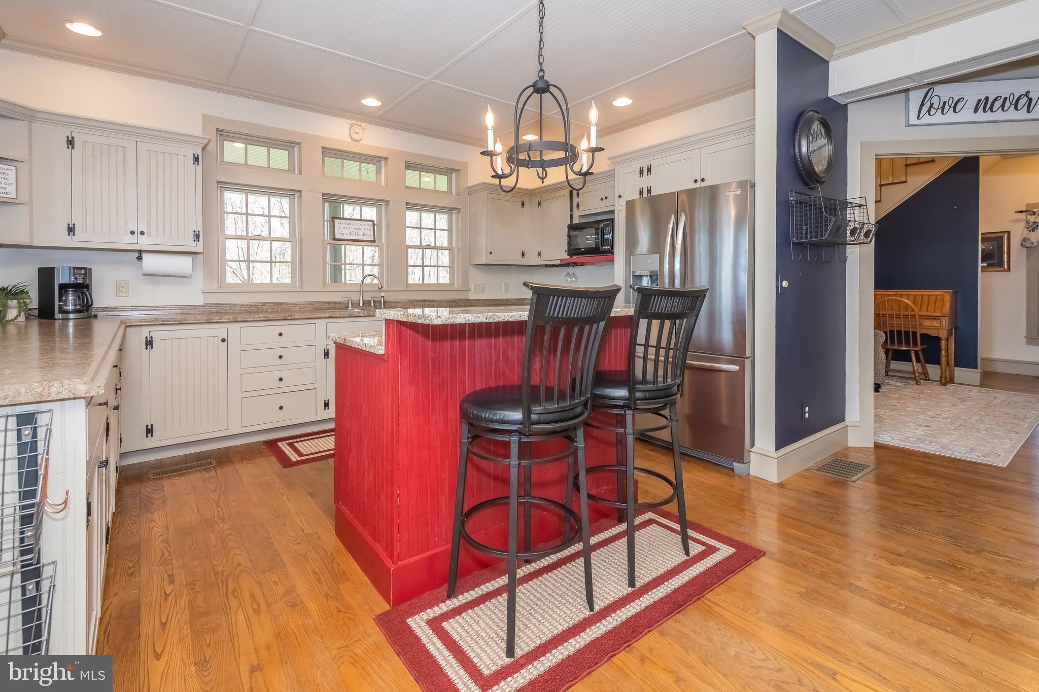 726 Sunset Ridge Drive McHenry, MD 21541 - Photo 7 of 50 a view of a dining room with furniture window and wooden floor