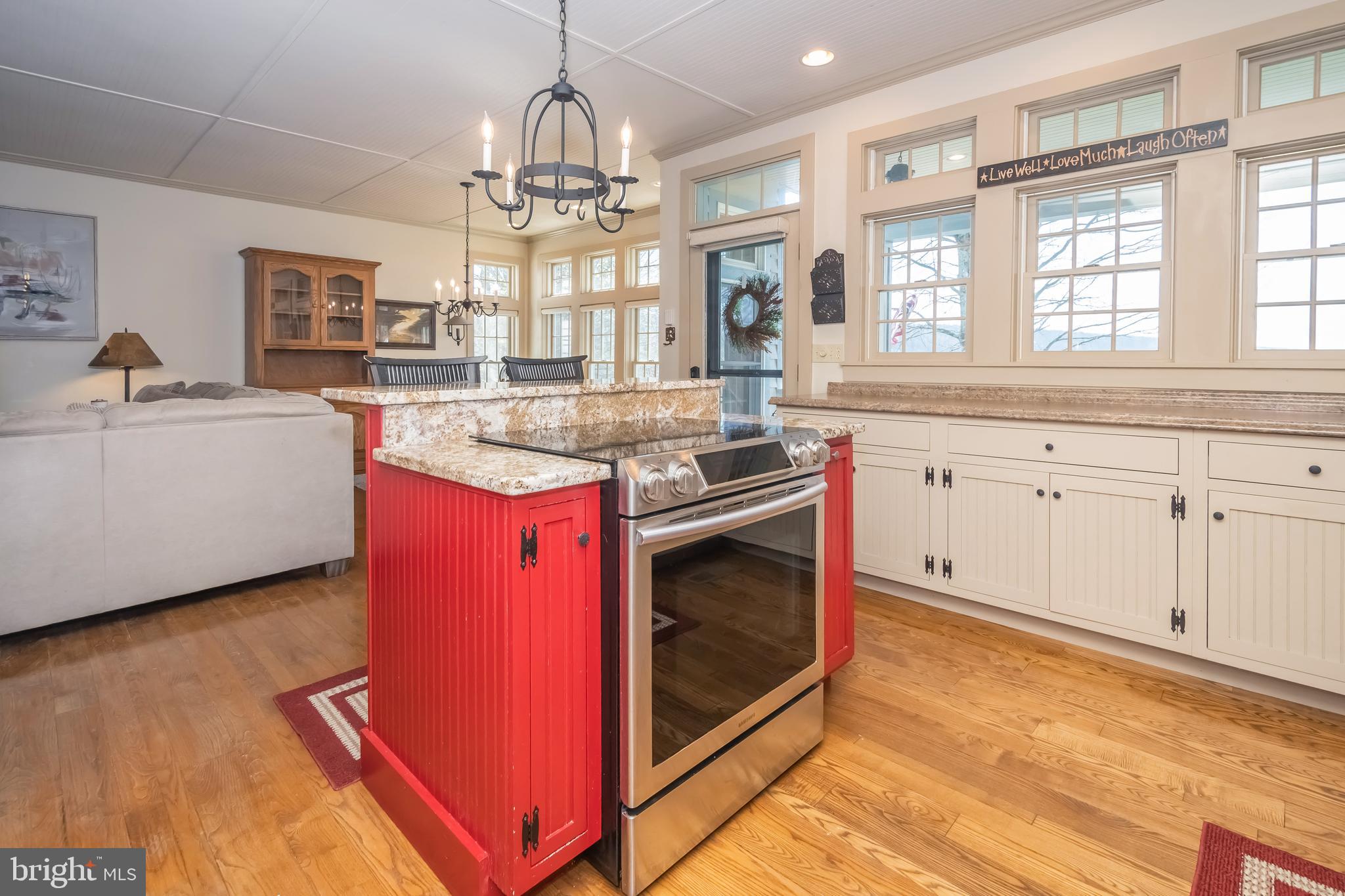 726 Sunset Ridge Drive McHenry, MD 21541 - Photo 10 of 50 a kitchen with stainless steel appliances granite countertop a stove and a sink