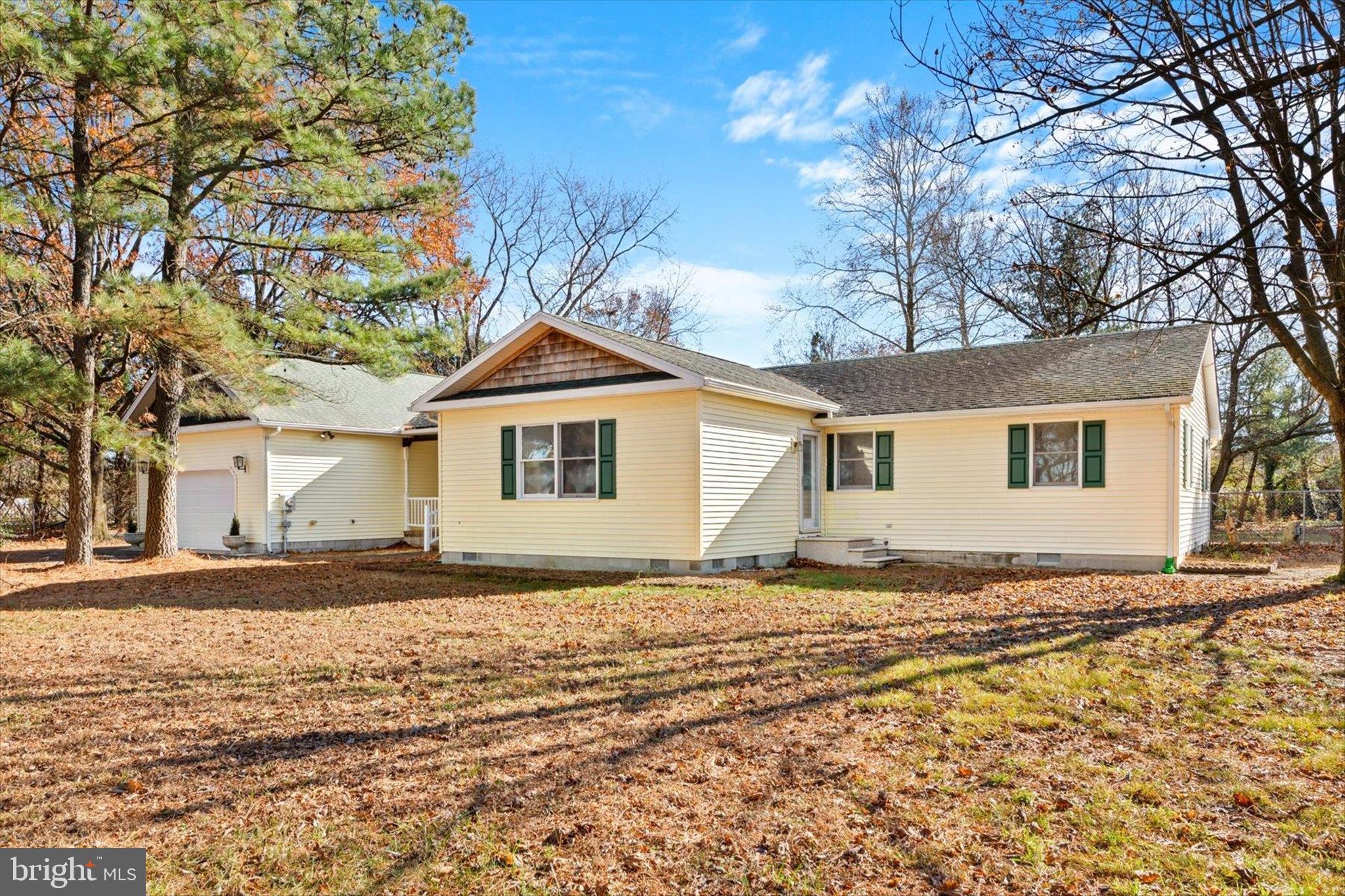 12468 Taylor Mill Road Laurel, DE 19956 - Photo 1 of 37 a front view of a house with a yard