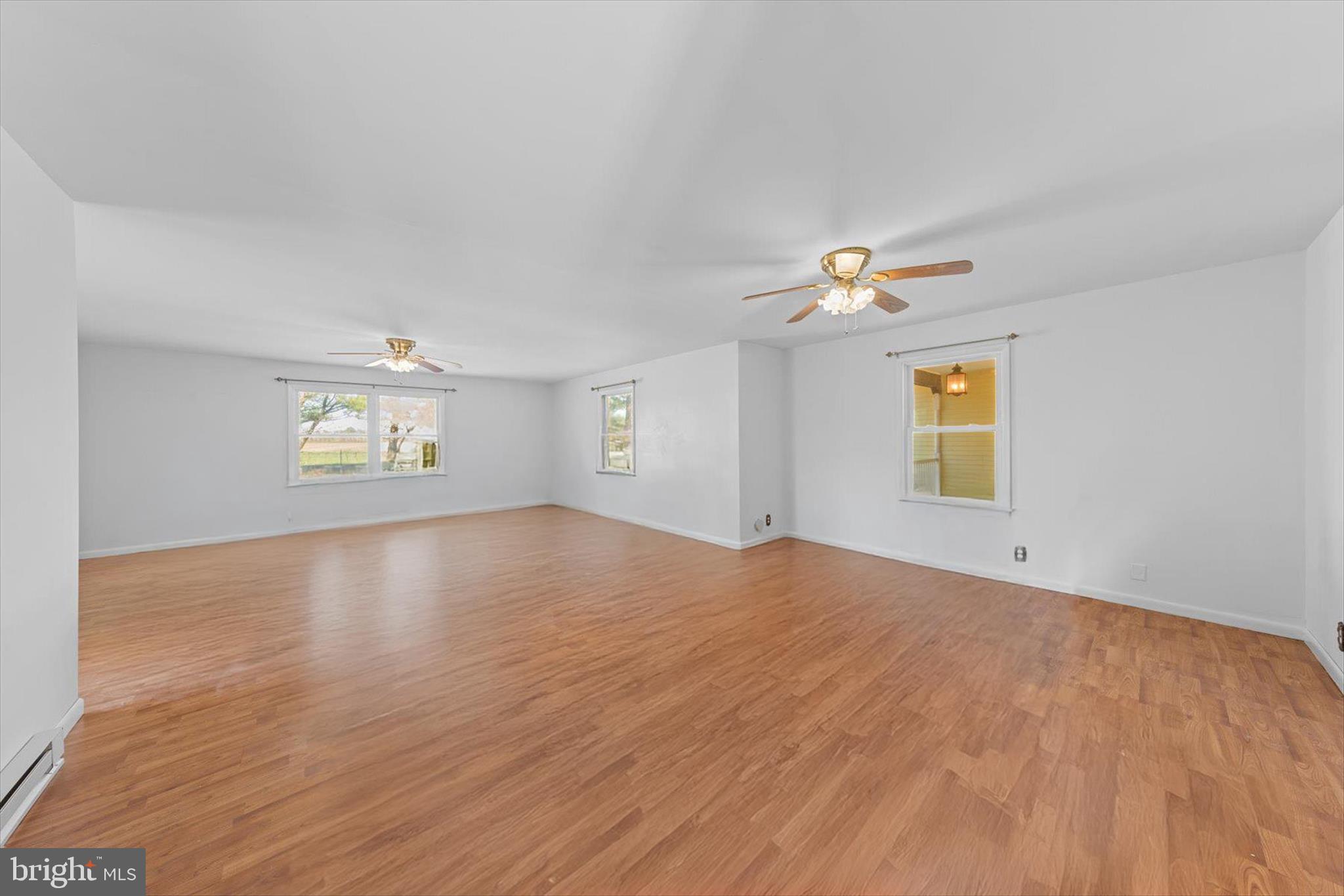 12468 Taylor Mill Road Laurel, DE 19956 - Photo 16 of 37 a view of an empty room and a window