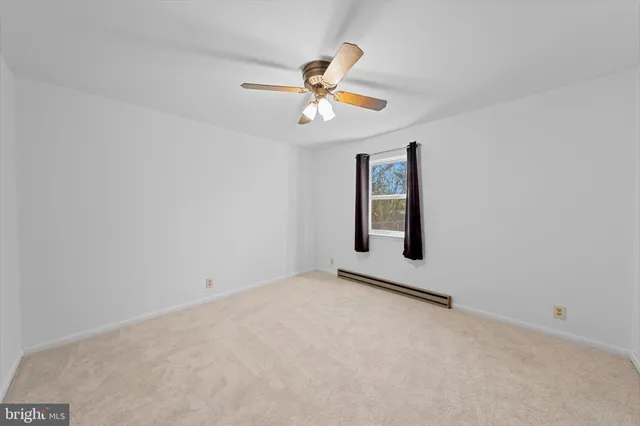 a view of a storage & utility room with a washer dryer