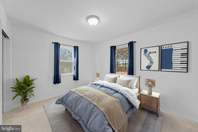 a bedroom with a bed and a couch