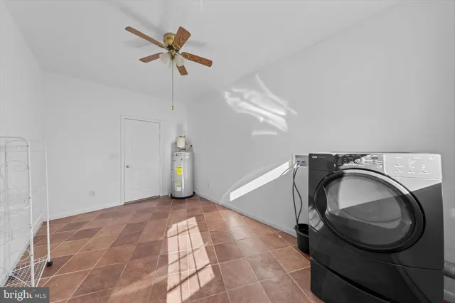 a view of a storage & utility room with a washer dryer