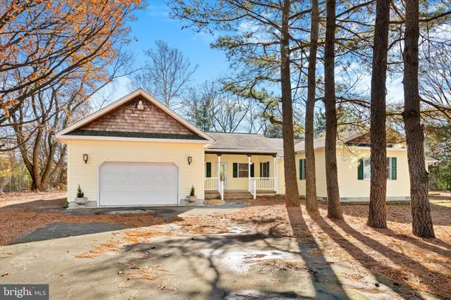 a view of a house with porch and wooden floor