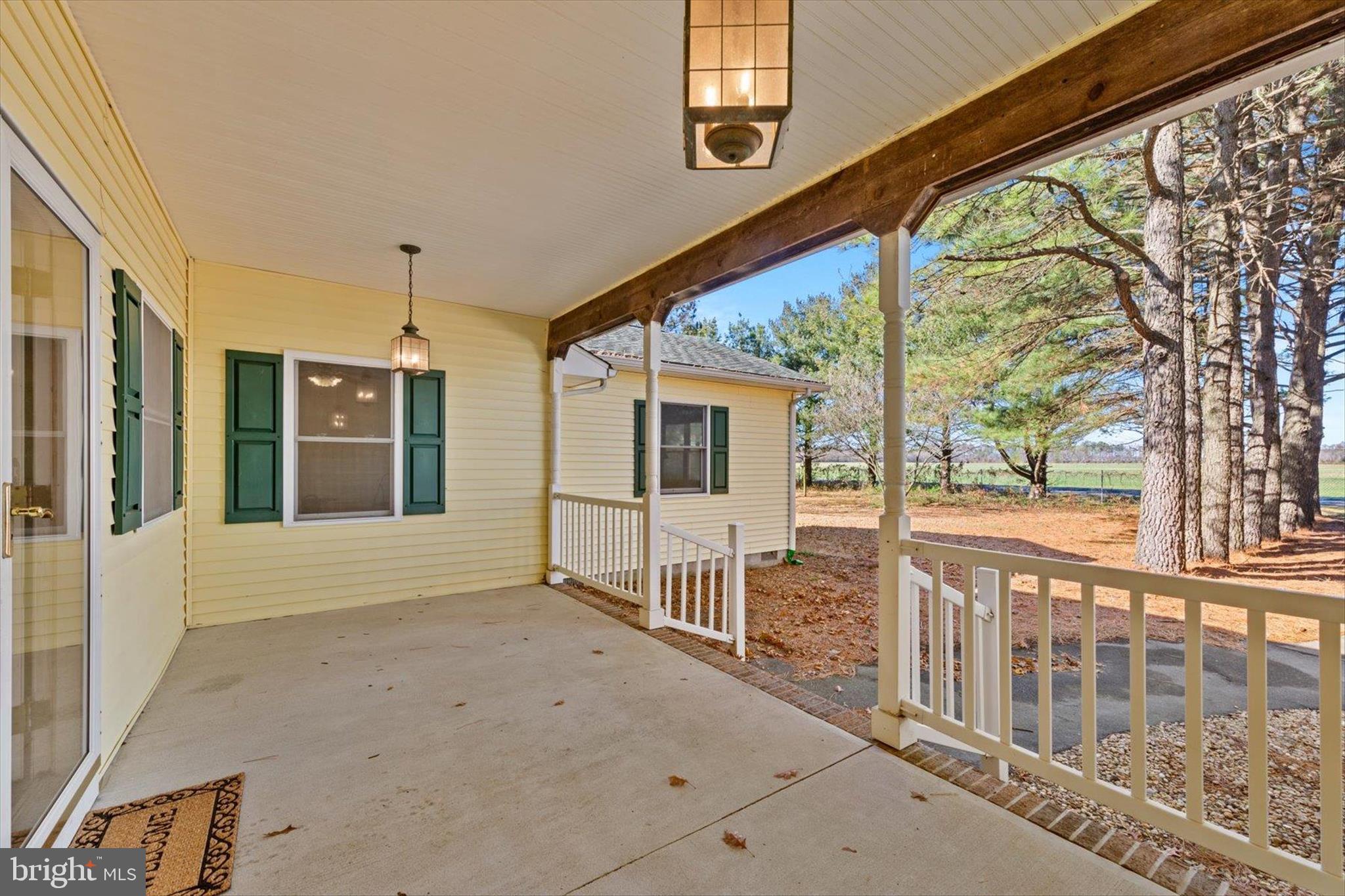 12468 Taylor Mill Road Laurel, DE 19956 - Photo 4 of 37 a view of a house with porch and wooden floor