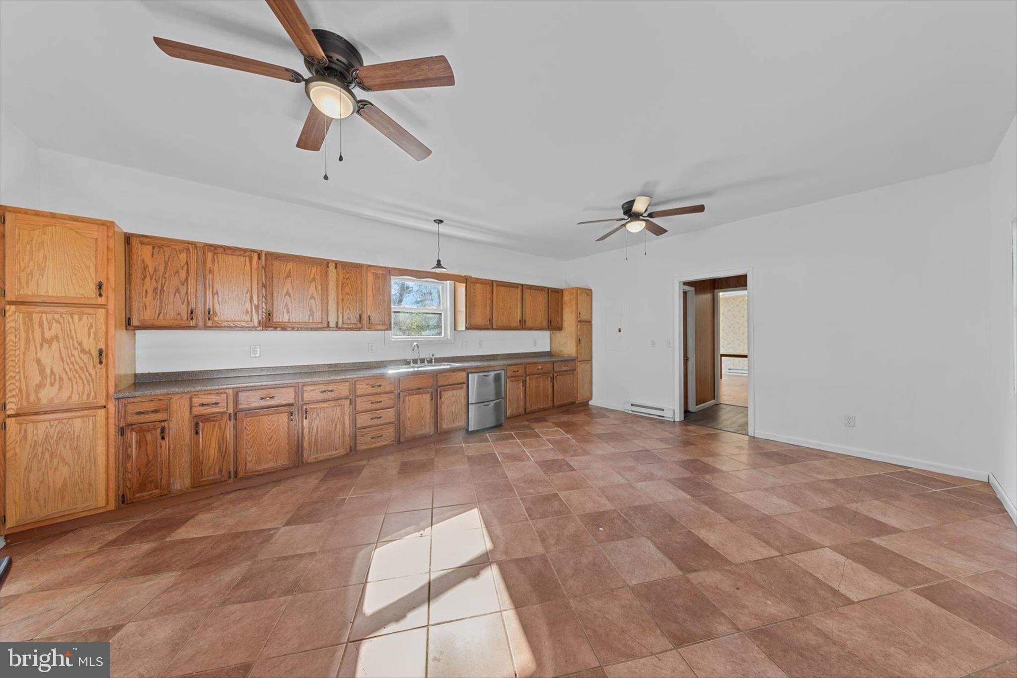 12468 Taylor Mill Road Laurel, DE 19956 - Photo 7 of 37 a view of an empty room with a window