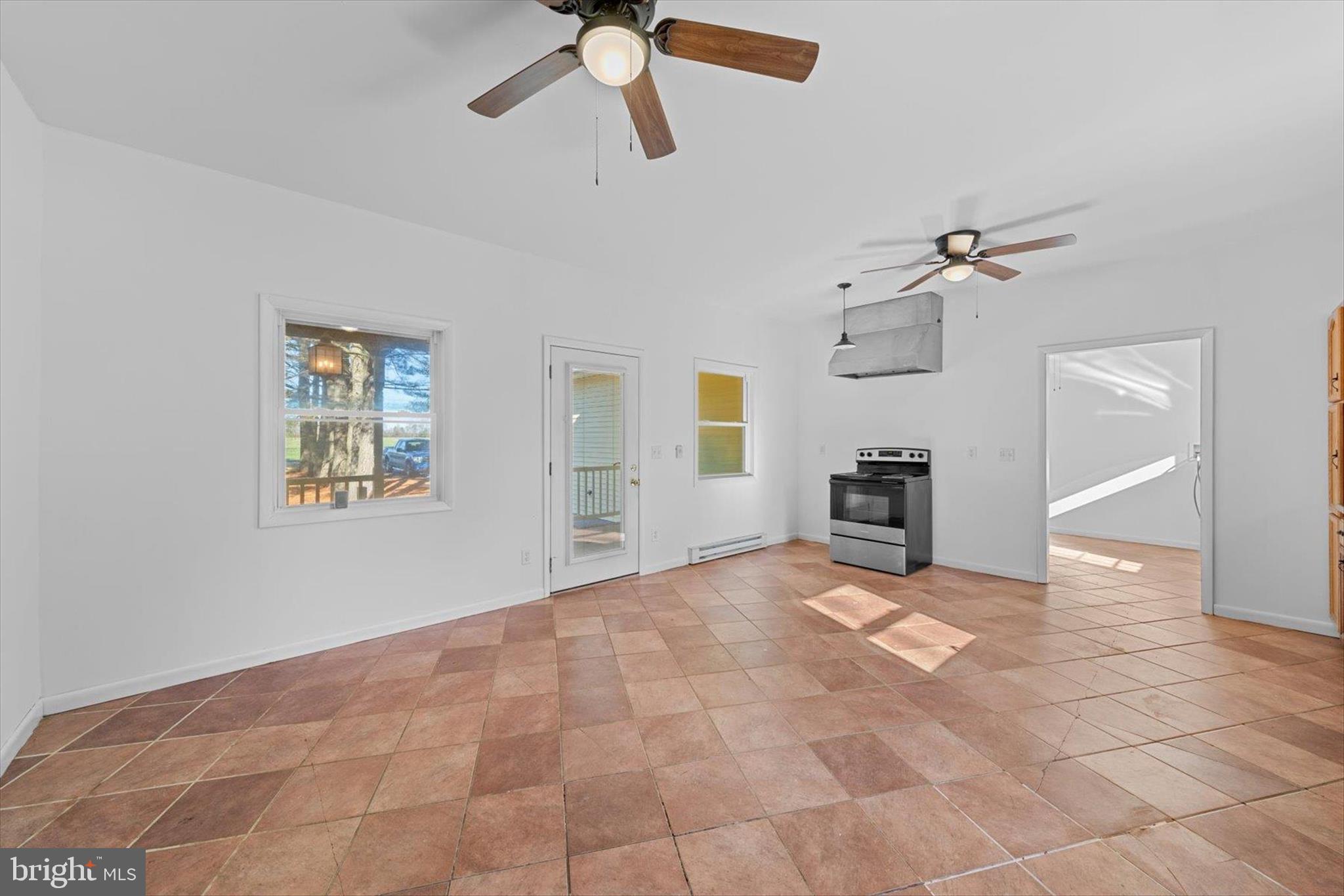 12468 Taylor Mill Road Laurel, DE 19956 - Photo 9 of 37 a view of livingroom with hardwood floor and a ceiling fan