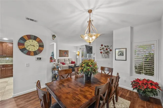 a kitchen with stainless steel appliances granite countertop wooden cabinets microwave and stove