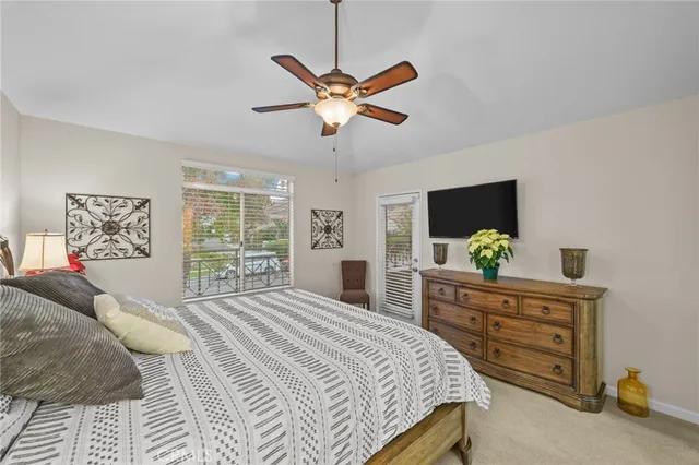 a view of a bedroom and a balcony