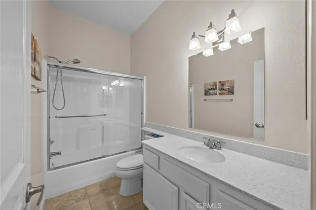 a bathroom with a shower and mirror