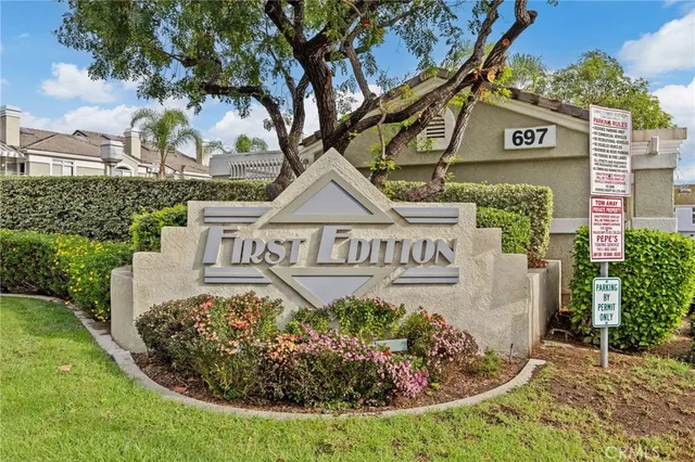 a view of a house with more windows and brick walls