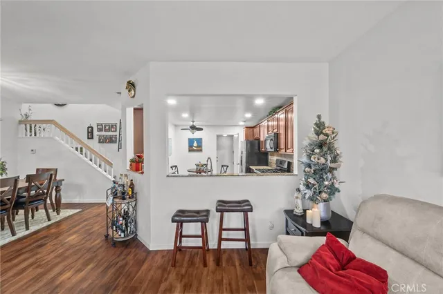 a view of a dining room with furniture and wooden floor