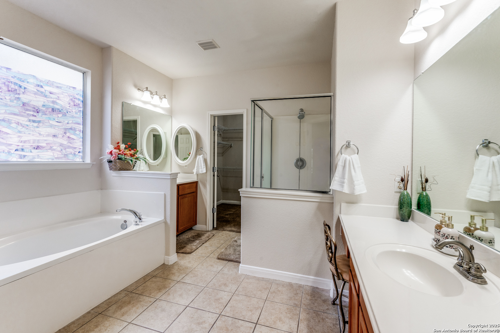 1935 Walter Raleigh Windcrest, TX 78239 - Photo 12 of 27 a bathroom with a tub sink toilet and mirror