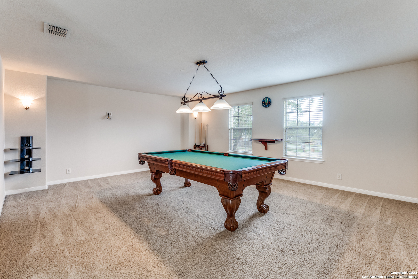 1935 Walter Raleigh Windcrest, TX 78239 - Photo 13 of 27 a room with pool table and windows