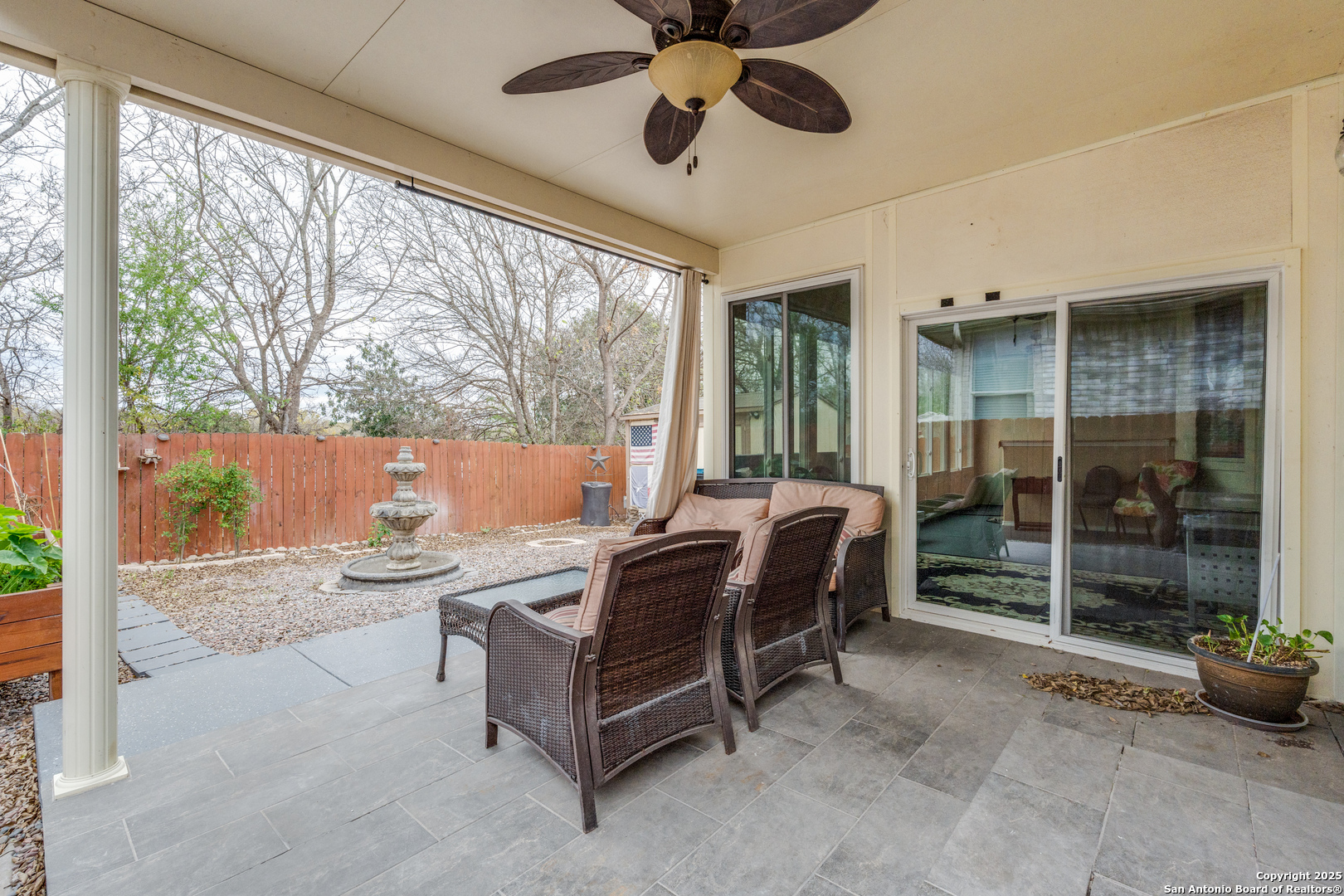 1935 Walter Raleigh Windcrest, TX 78239 - Photo 19 of 27 a living room with furniture and a floor to ceiling window