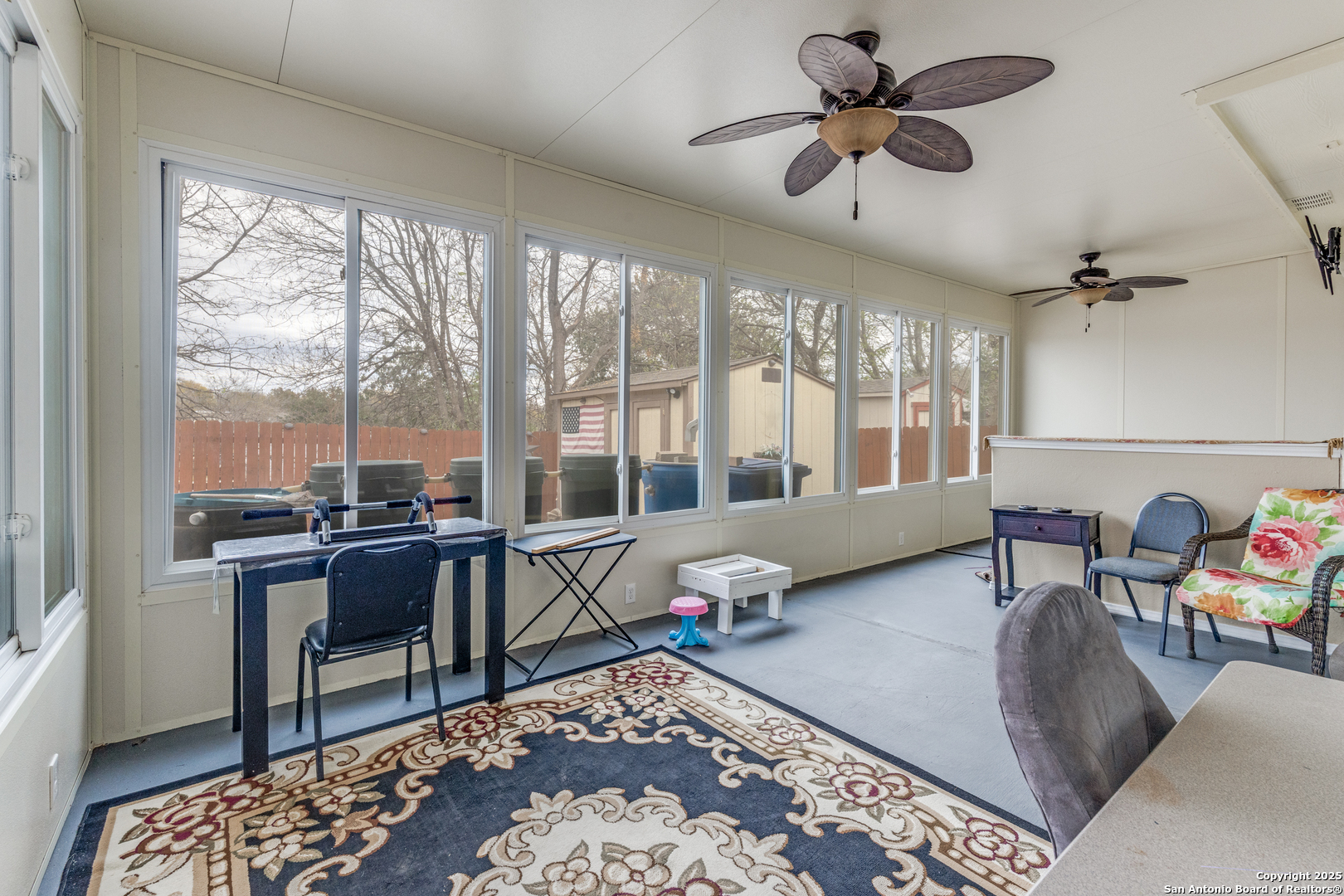 1935 Walter Raleigh Windcrest, TX 78239 - Photo 20 of 27 a living room with furniture and a large window