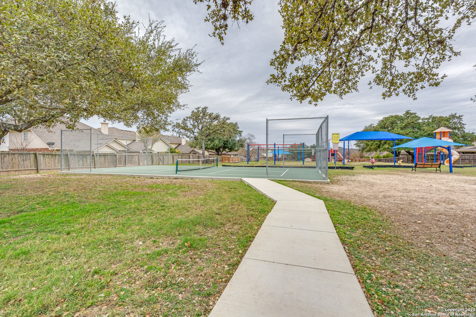 1935 Walter Raleigh Windcrest, TX 78239 - Photo 24 of 27 a view of outdoor space with garden and trees