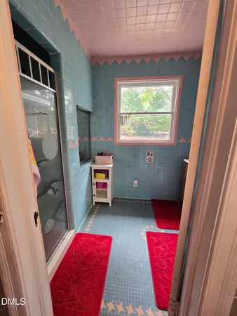 a bathroom with a sink toilet vanity and mirror