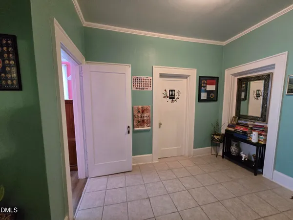 a view of kitchen with furniture and a refrigerator
