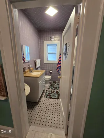 a kitchen with a sink a stove and cabinets