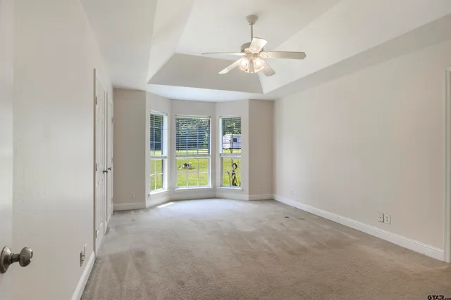 a garden view with a swimming pool