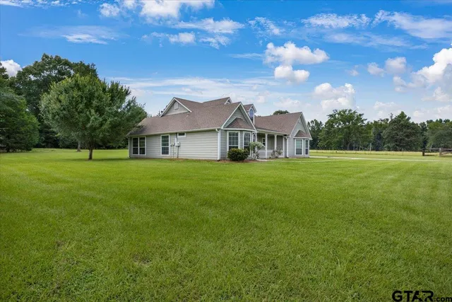 a house view with garden space