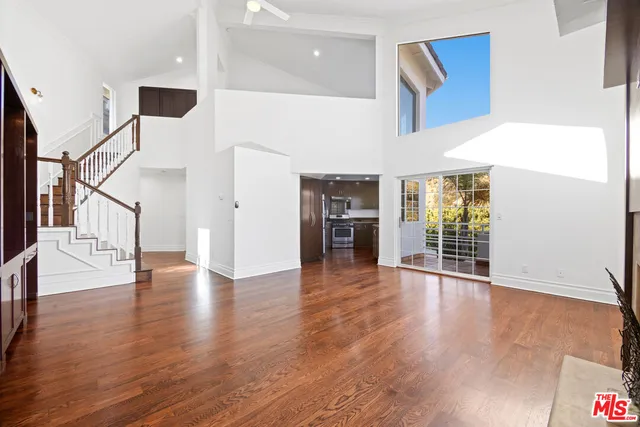 a view of an entryway with wooden floor