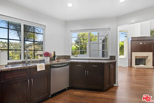 a kitchen with a sink and wooden cabinets
