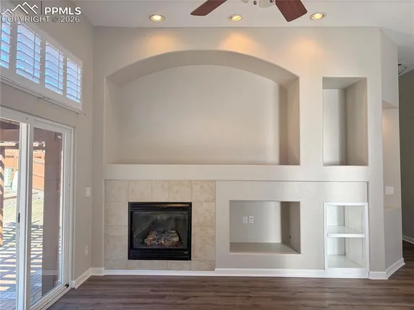 a view of an entryway with wooden floor