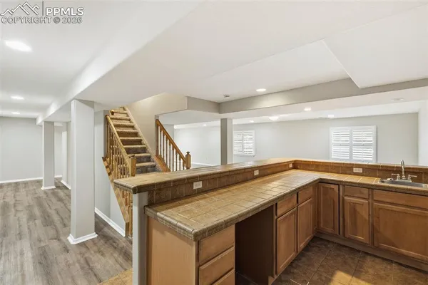 a kitchen with a sink stove and cabinets