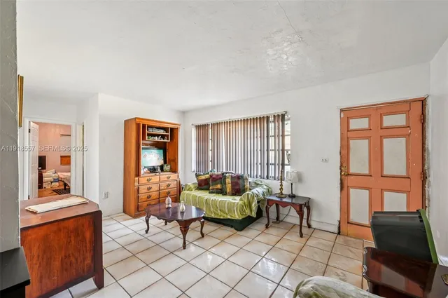 a living room with furniture and a window