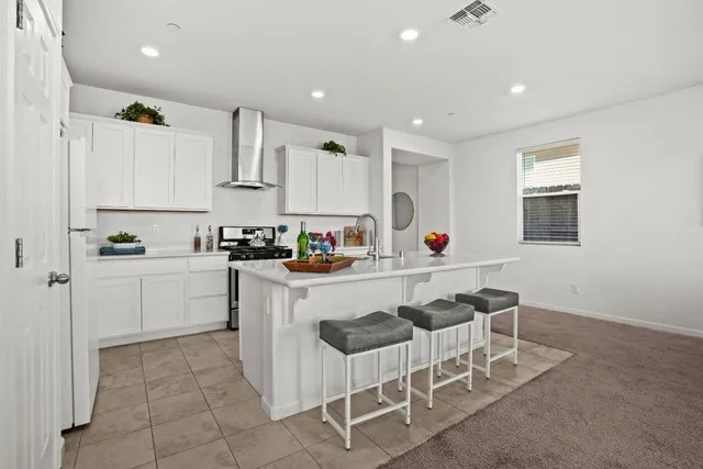 a kitchen with stainless steel appliances granite countertop a sink counter space and cabinets