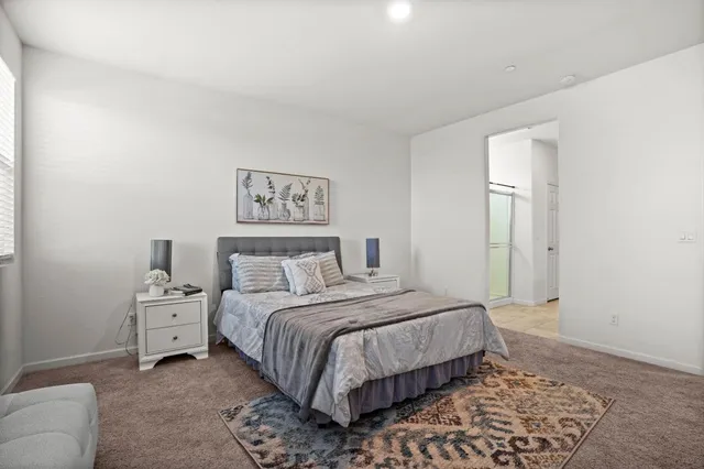 a bedroom with a bed and a couch