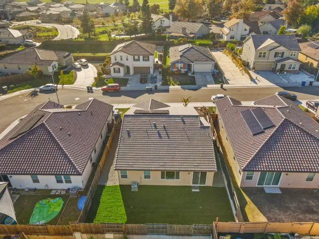 an aerial view of a house with a ocean view