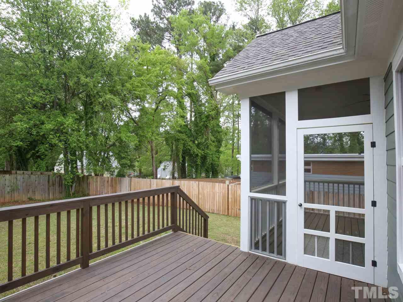 1101 North State Street Raleigh, NC 27604 - Photo 14 of 25 a view of a wooden deck and a yard