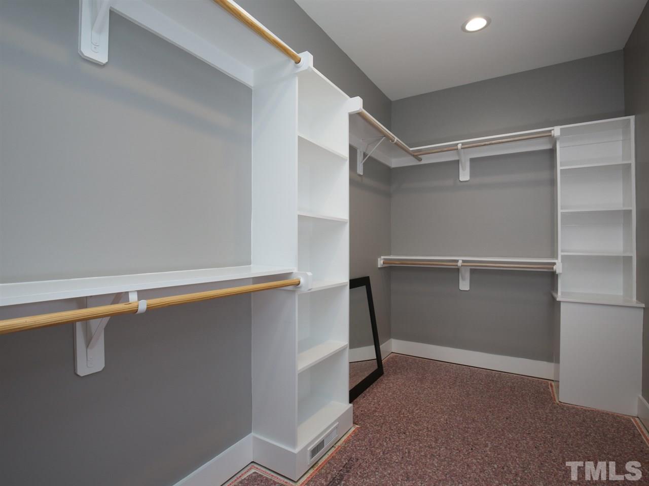 1101 North State Street Raleigh, NC 27604 - Photo 18 of 25 a view of walk in closet with empty racks