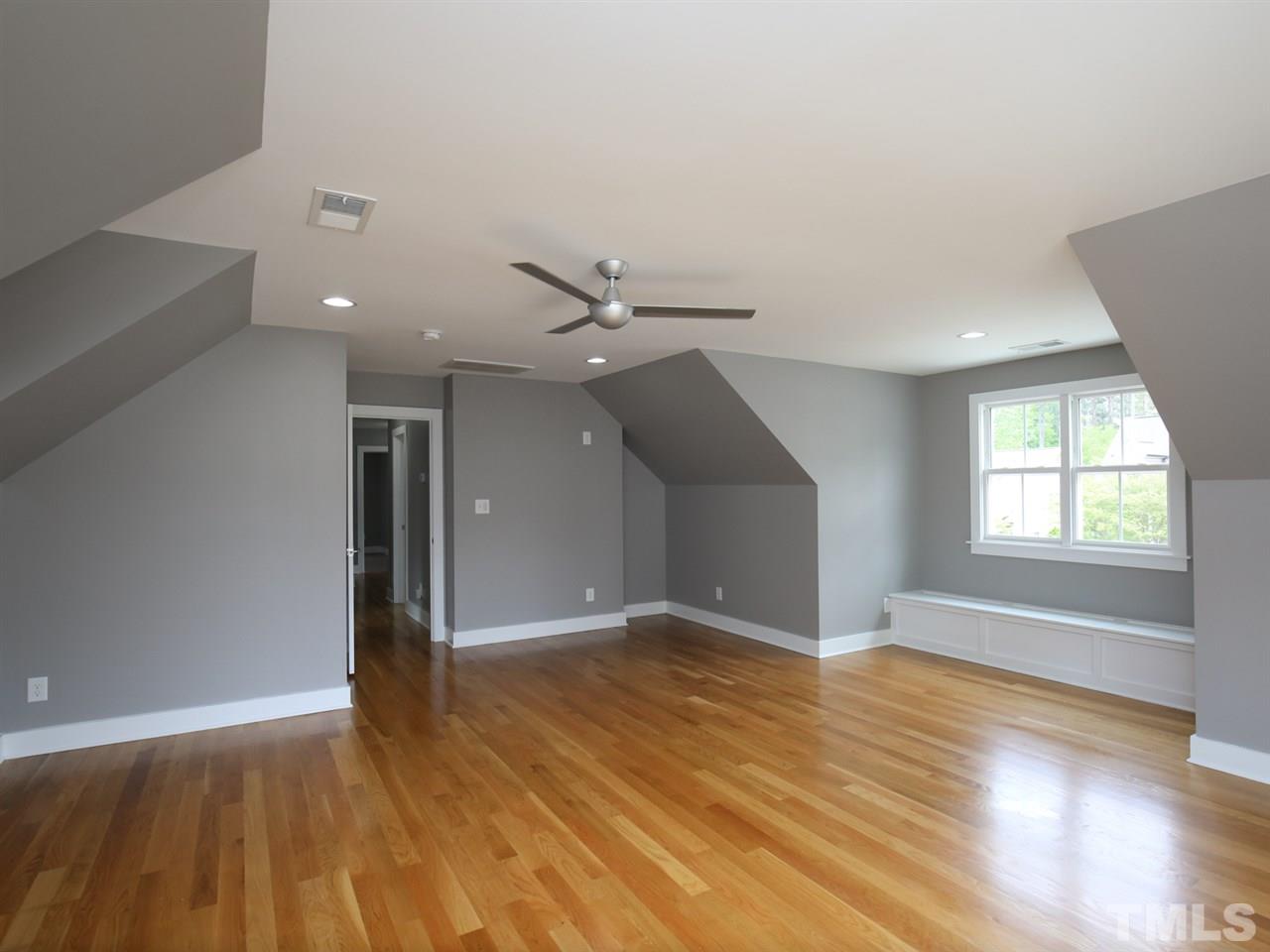 1101 North State Street Raleigh, NC 27604 - Photo 19 of 25 wooden floor in an empty room with a window
