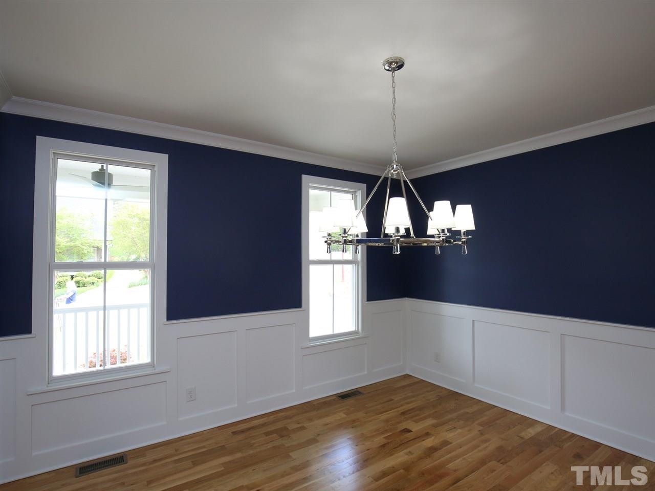 1101 North State Street Raleigh, NC 27604 - Photo 3 of 25 a view of an empty room with wooden floor and a window