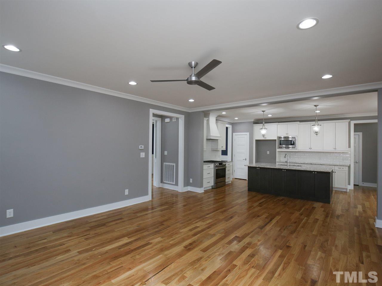 1101 North State Street Raleigh, NC 27604 - Photo 7 of 25 a view of an empty room with kitchen and a window