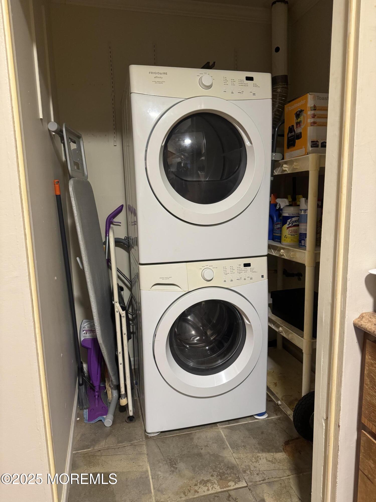 9 Valery Road, Unit 651 Matawan, NJ 07747 - Photo 5 of 7 a utility room with dryer and washer