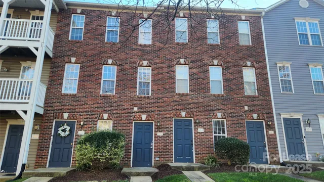 a front view of a building with garden