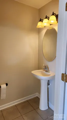 a bathroom with a sink and mirror