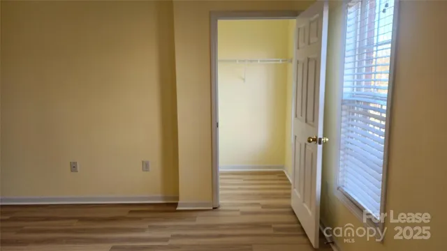 a view of a bathroom with wooden floor