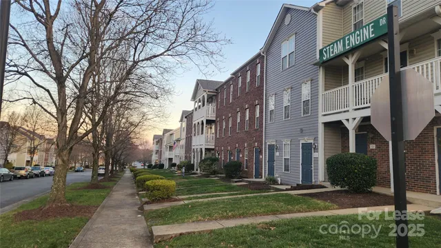 a view of a building with a yard