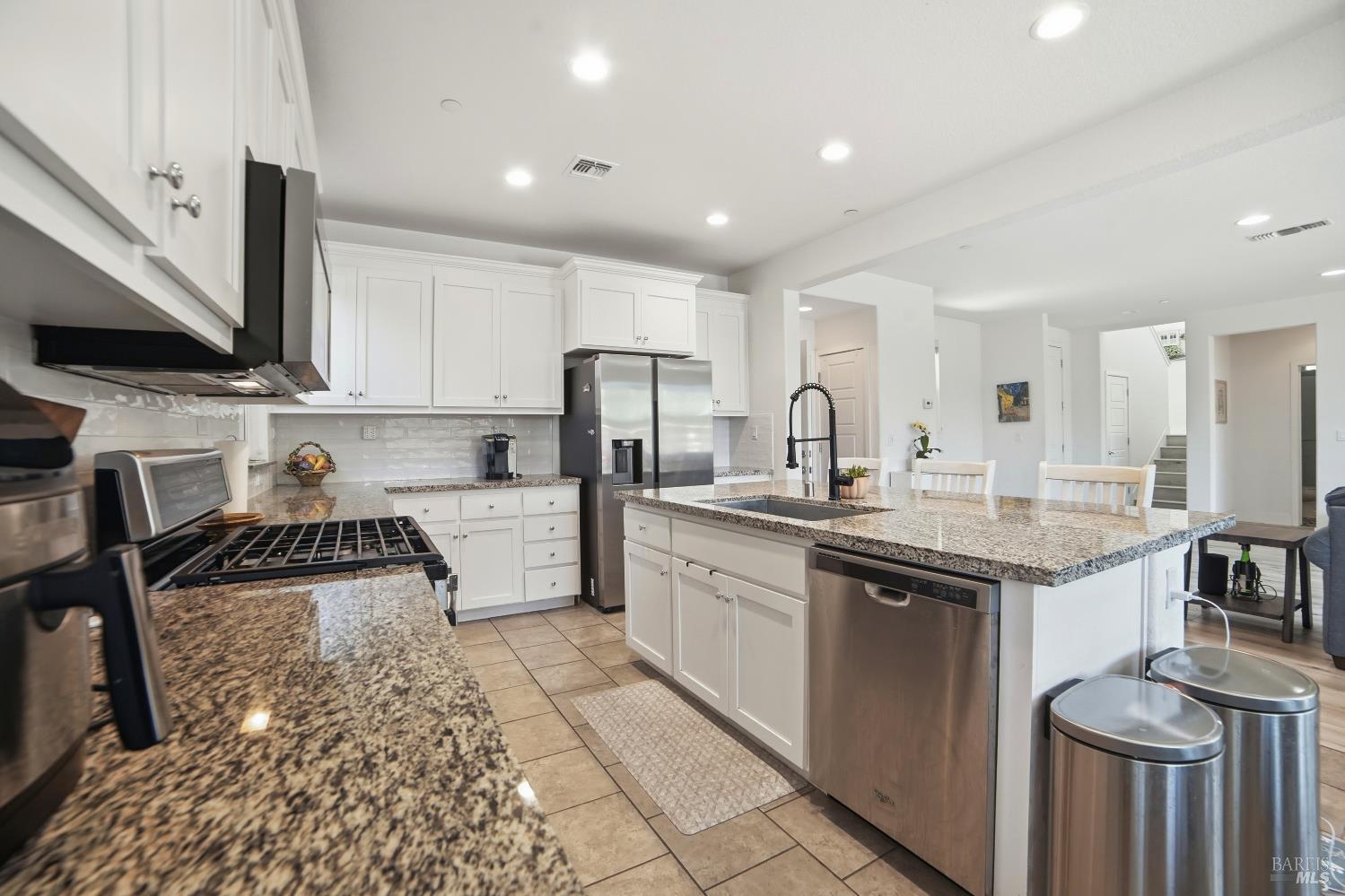 5305 Kirby Place Rohnert Park, CA 94928 - Photo 7 of 37 a kitchen with stainless steel appliances granite countertop a sink stove and refrigerator